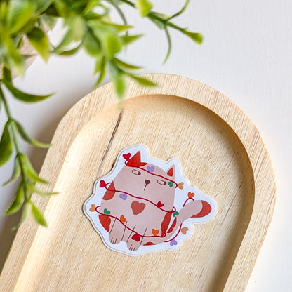 Sticker – Chat dans sa guirlande de cœurs